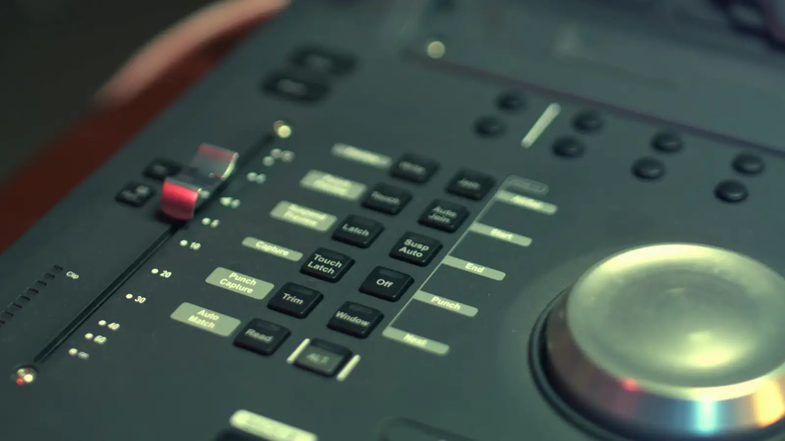 A close view of an audio mixing console